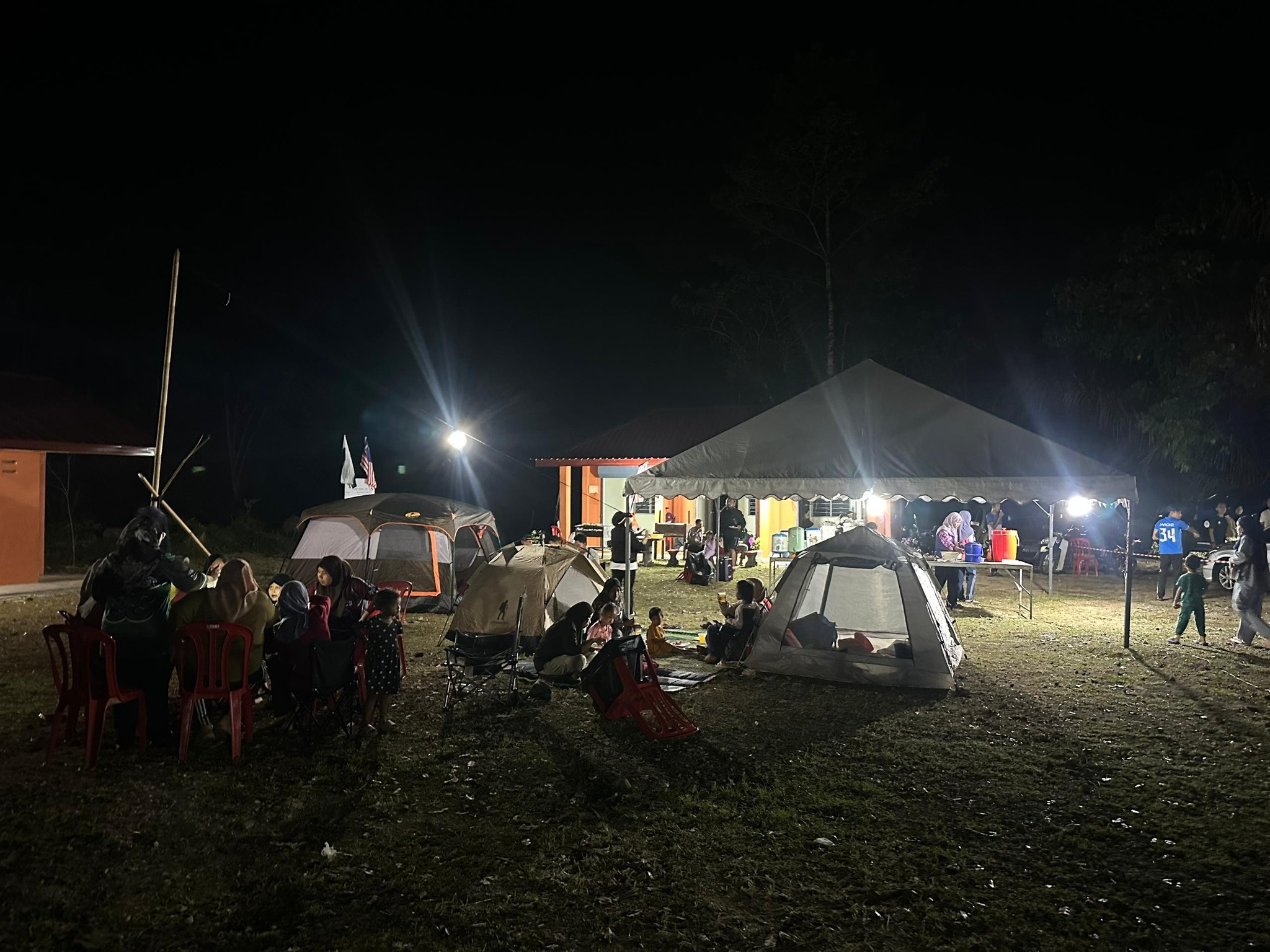 Camping facilities and rest area near the entrance of Gua Bama with basic amenities