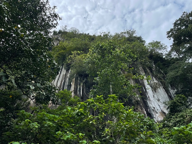 Panoramic views from Gua Bama summit overlooking forested valleys and Kuala Lipis landscape